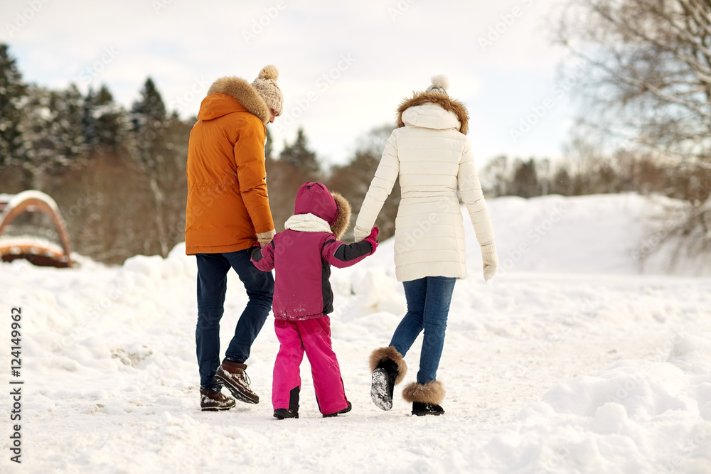 happy family in winter clothes walking outdoors happy family in winter clothes walking outdoors
