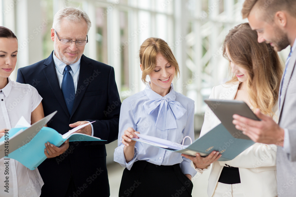 business team with tablet pc and folders at office business team with tablet pc and folders at office