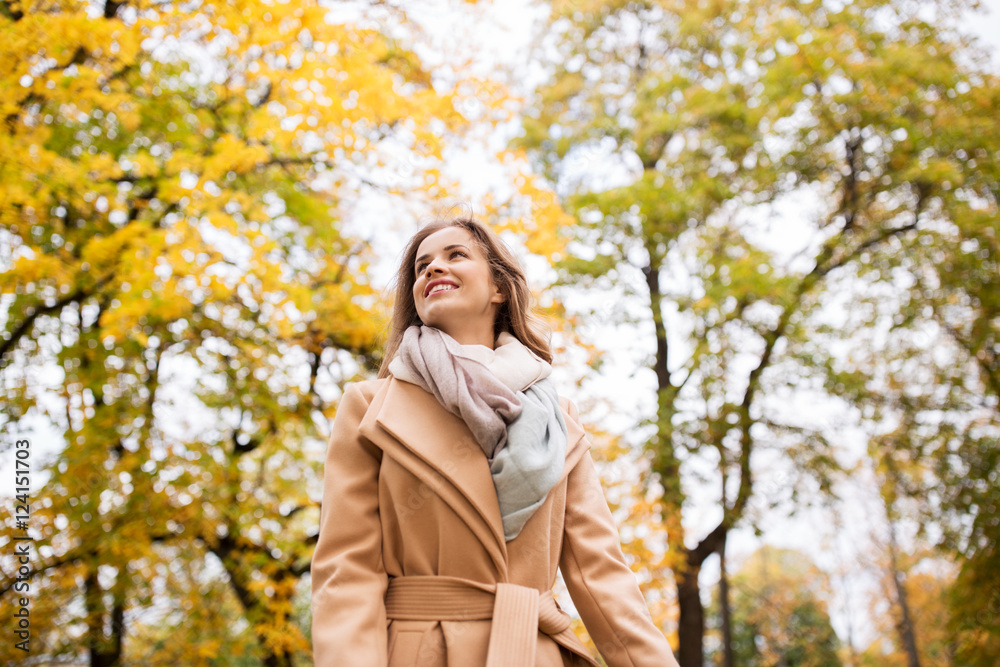 beautiful happy young woman walking in autumn park beautiful happy young woman walking in autumn park