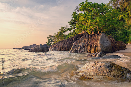 Beautiful seascape. Sea and rock at the sunset. Nature composition. Thai beach in sunset time in Koh Chang island, Thailand. © sonatalitravel
