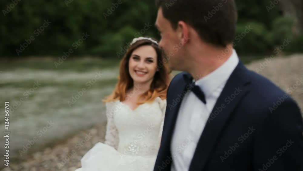 happy bride and groom near the river happy bride and groom near the river