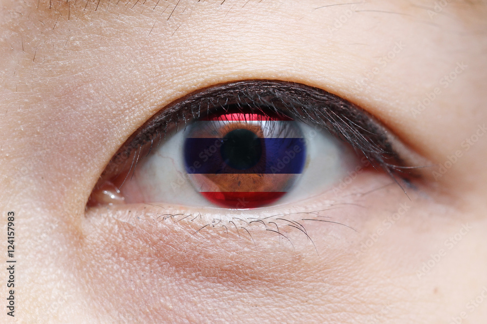 Obraz premium woman eye with thailand national flag inside