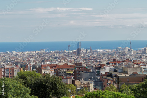 Barcelona, Spain panoramic view from Nature Square at Park Guell Monumental Zone.  The public park designed by Antoni Gaudi offers a wide view of Barcelona City.   © bestravelvideo