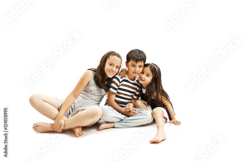 
Adorable family. Two sister and brother. Isolated on a white background 