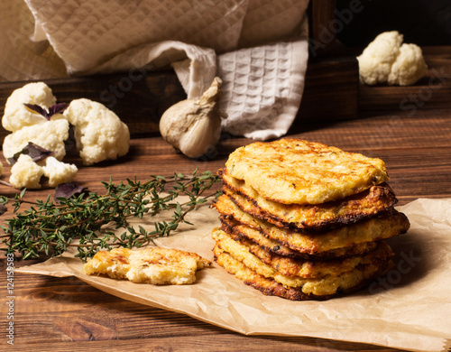 Hash browns cauliflower on a brown wooden background, selective focus, horizontal vertical