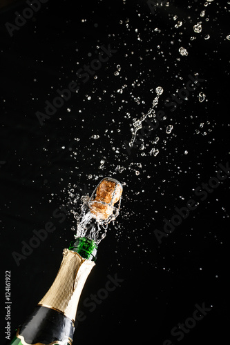 Slika na platnu Classic champagne bottle with cork exploding, alcoholic beverage