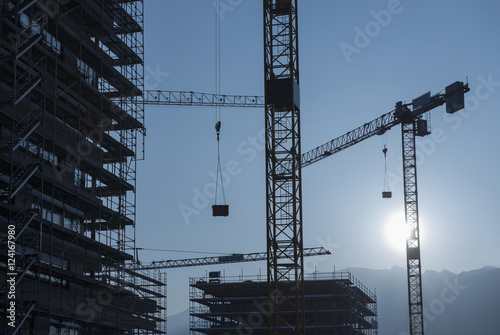 Cranes and scaffolding for building construction, Locarno, Ticino, Switzerland