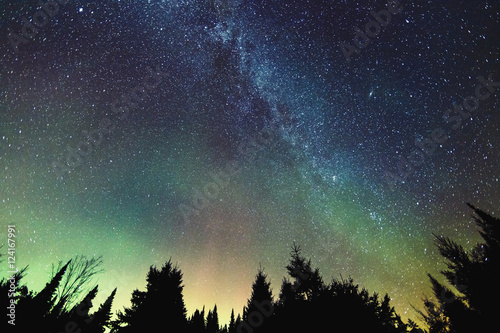 Aurora Borealis and milky way visible in the sky, Mont-Tremblant National Park; Lanaudiere region, Quebec, Canada photo