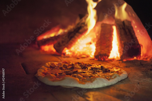 Close-up of pizza baked inside the oven photo