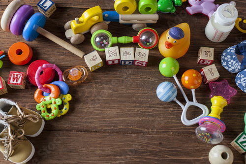 Children s World toy on a wooden background.