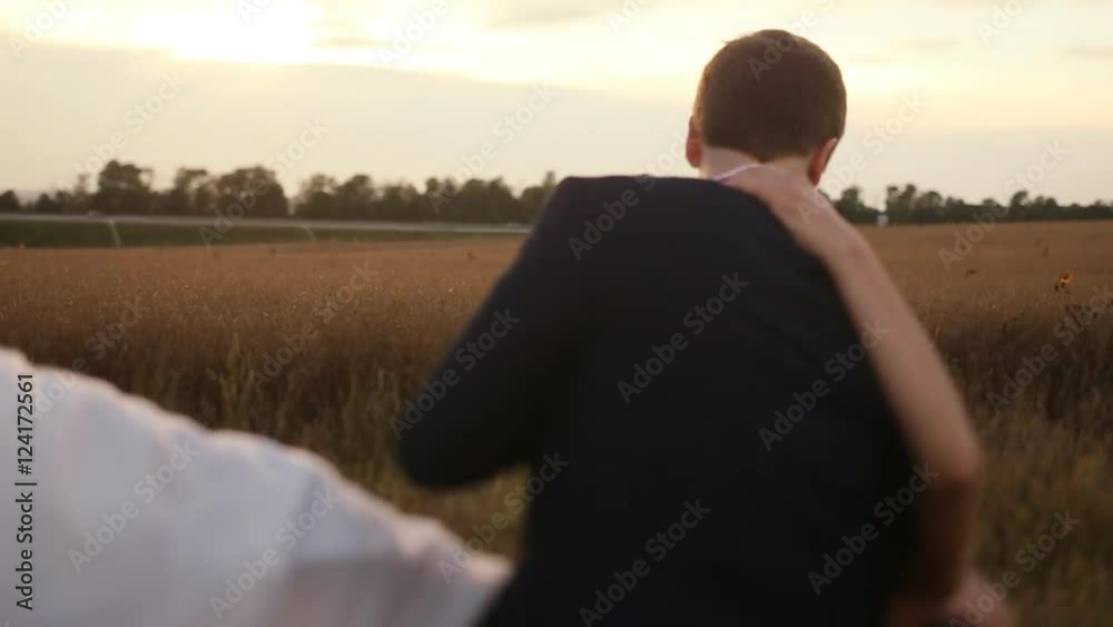 Bride and groom are dancing at the wheat field Bride and groom are dancing at the wheat field