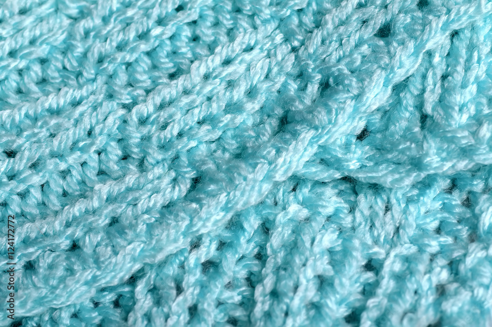 Piece of knitting work - blue yarn stitches - macro Piece of knitting work - blue yarn stitches - macro