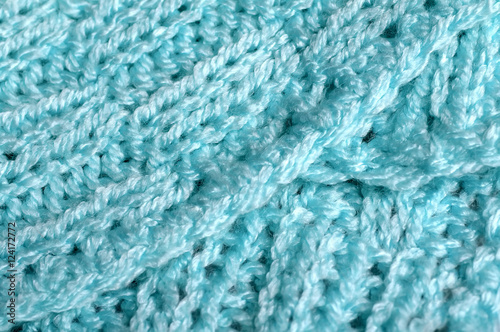 Piece of knitting work - blue yarn stitches - macro