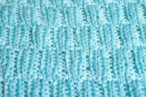 Piece of knitting work - blue yarn stitches - macro