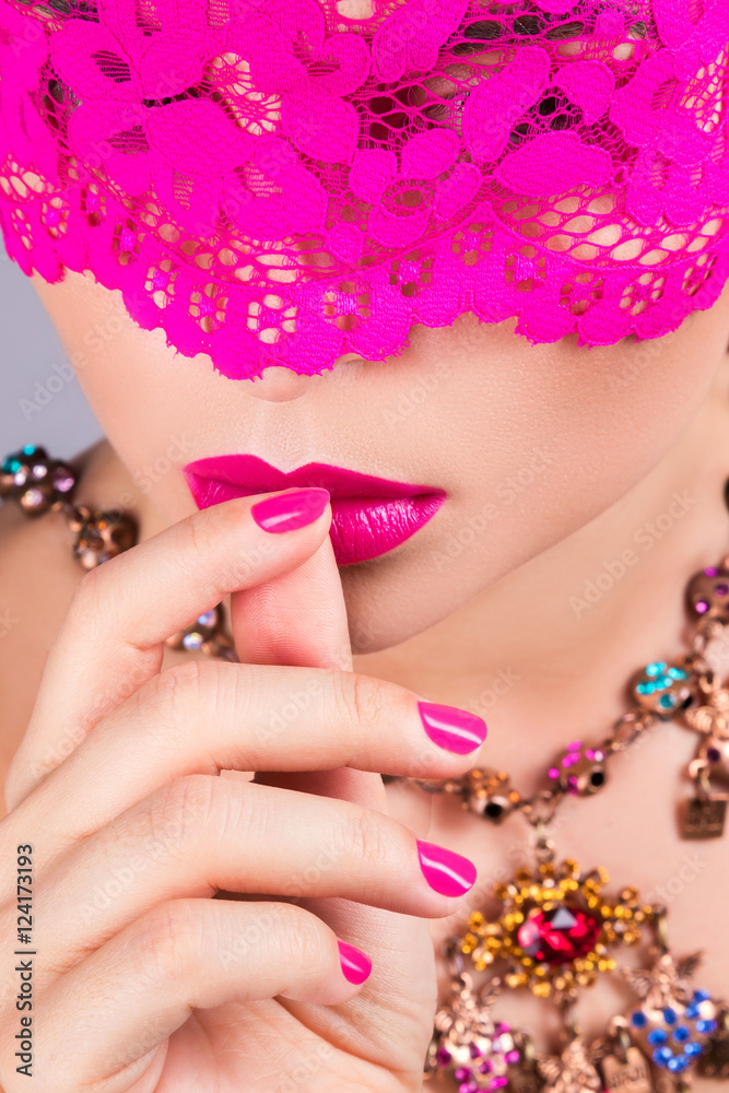 Fototapeta premium Woman with pink blindfold on her eyes