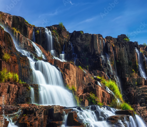 Tropical rainforest landscape with flowing Pongour waterfall. Da Lat, Vietnam