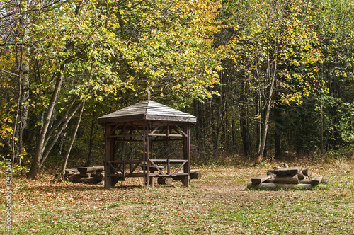 Wooden pavilion in mountain forest park tourist rest area