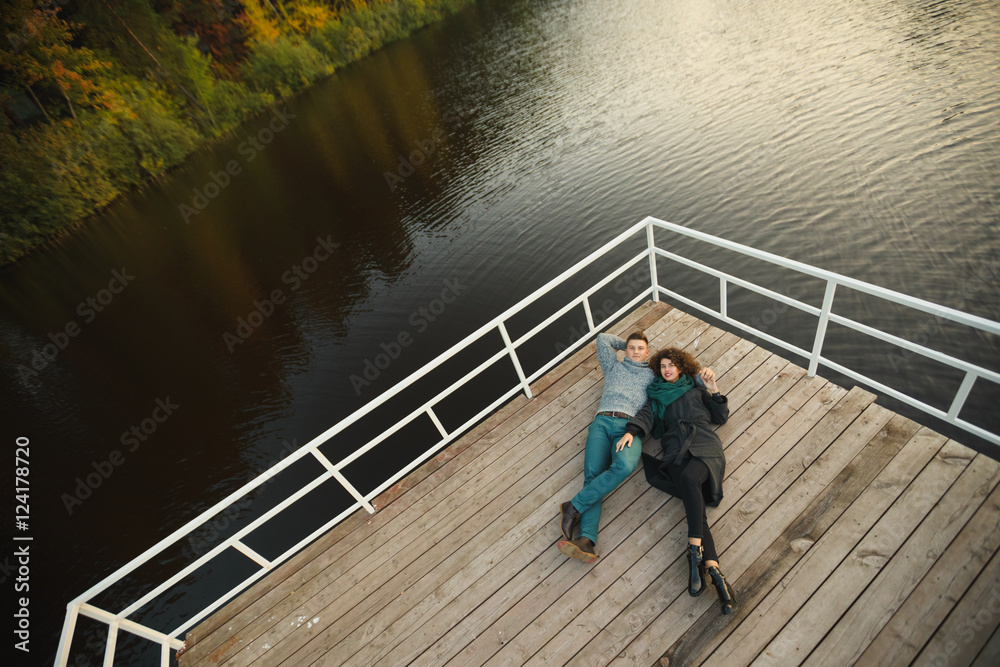 Romantic Couple sitting on the pier