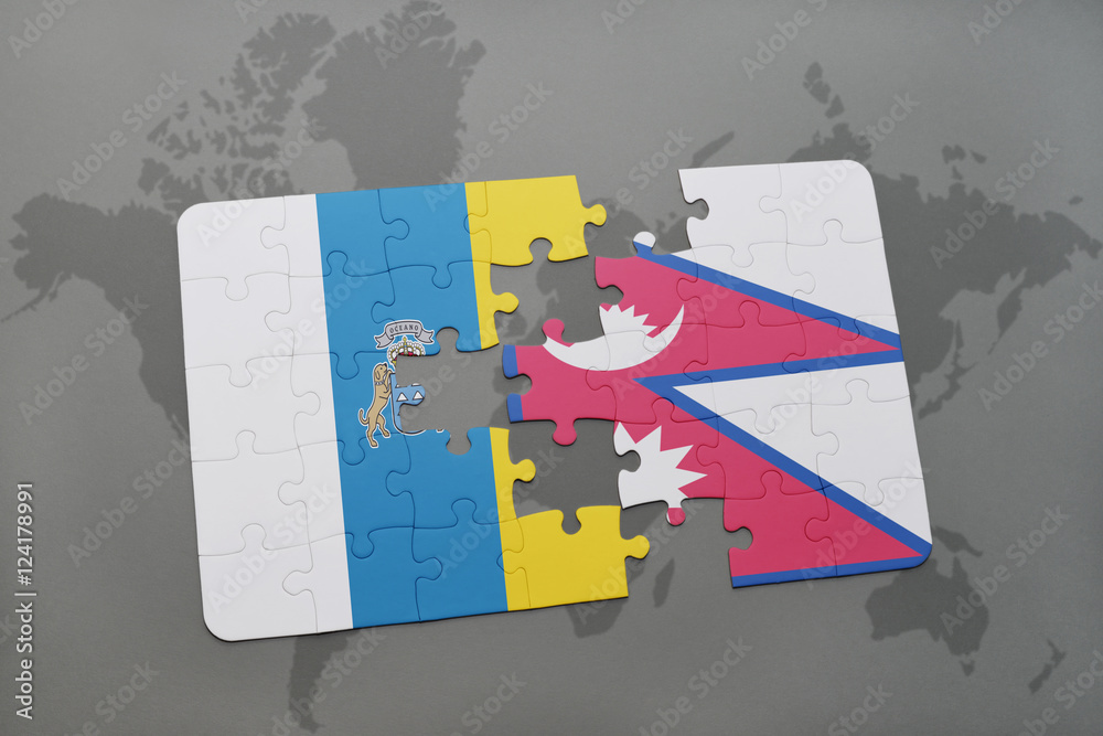 puzzle with the national flag of canary islands and nepal on a world map background. puzzle with the national flag of canary islands and nepal on a world map background.