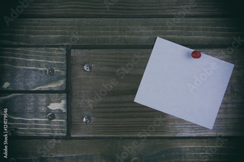 white paper sticker on the wooden background