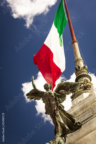 Sculpture on the background of the Italian flag