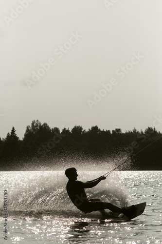 Wakeboarder trans in a cable park photo