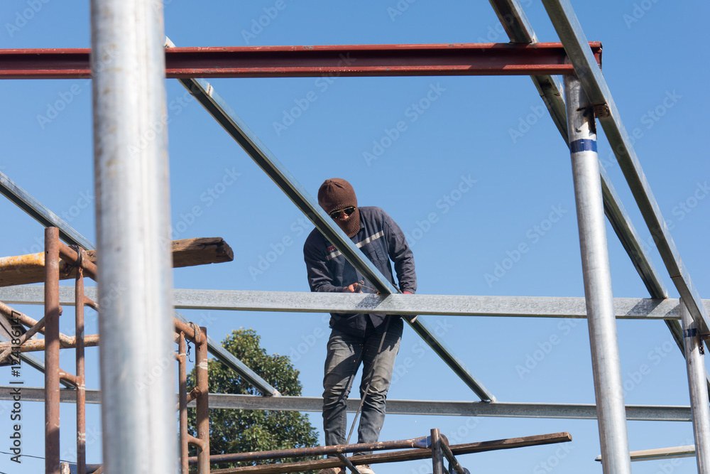 welder worker welding metal