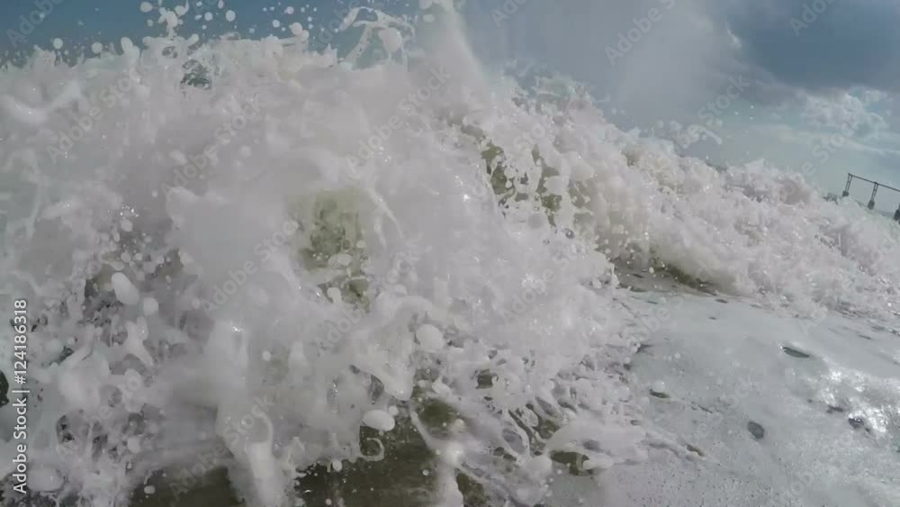 boy rotates in a spray of waves boy rotates in a spray of waves