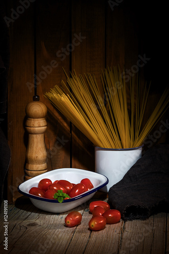 Spaghetti and tomatoes with herbs photo