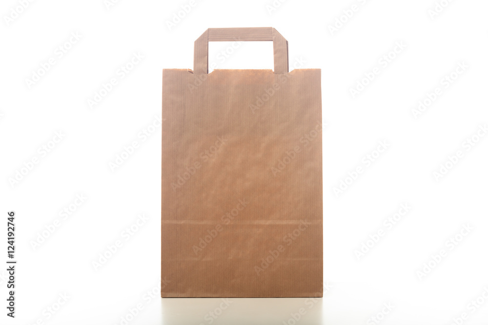 Brown paper shopping bag on white background Brown paper shopping bag on white background