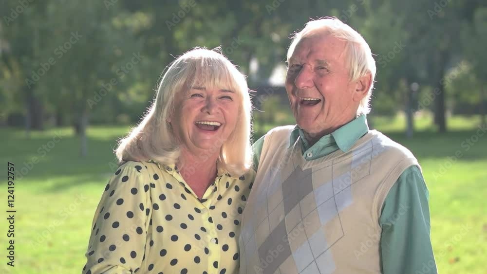 Elderly couple laughing. Man with woman outdoor. I love your jokes. Great mood every day. Elderly couple laughing. Man with woman outdoor. I love your jokes. Great mood every day.