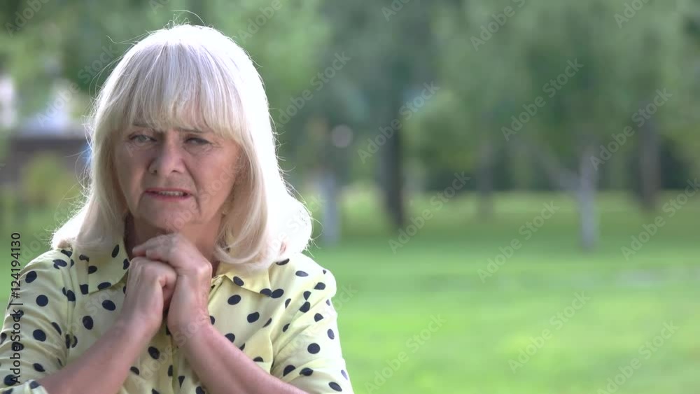 Nervous senior woman. Old female on nature background. Point of no return. Fear and anxiety. Nervous senior woman. Old female on nature background. Point of no return. Fear and anxiety.