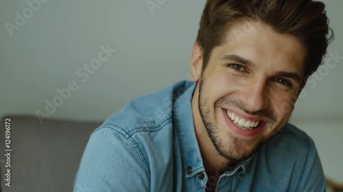 Adorable man smiling on camera.