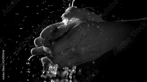 Close up of man washing hands with water