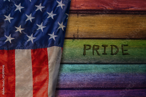 Rainbow Color on Wooden Plate with United State of America Flag and word : Pride, Rights of Lesbian, Gay, Bisexual and Transgendered People in America