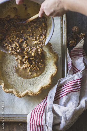 Walnuts mixture in the making of salty maple walnut pie photo