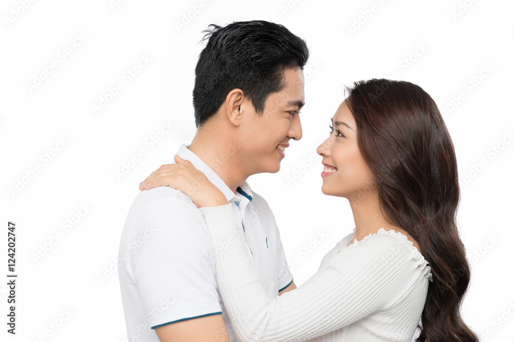 Happy asian couple isolated on white background. Cheerful young Happy asian couple isolated on white background. Cheerful young
