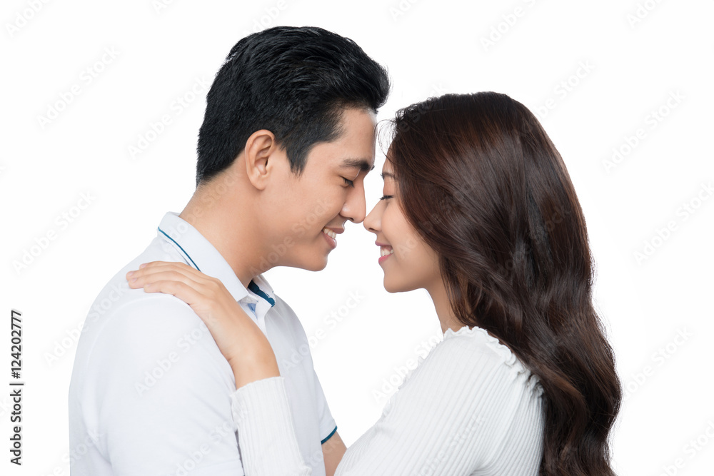 Happy asian couple isolated on white background. Cheerful young Happy asian couple isolated on white background. Cheerful young