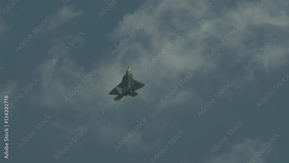 Tracking shot of military jet flying in sky Tracking shot of military jet flying in sky