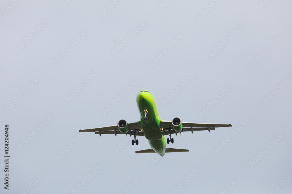 Fototapeta premium Bottom view airplane takeoff to the sky