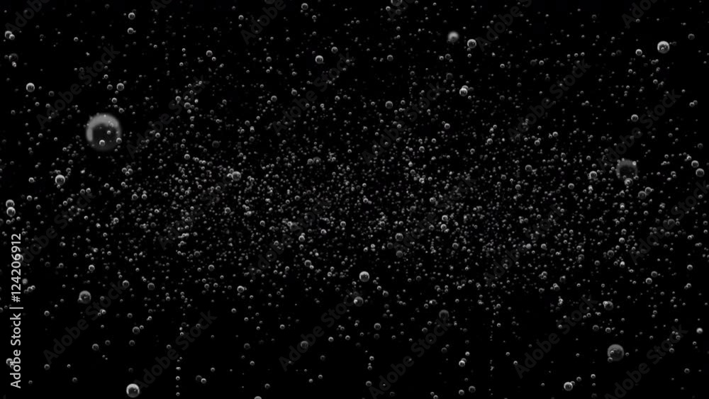 A black background of sparse soda bubble fizz with last 10 seconds loop at end.