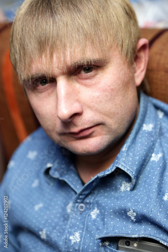 Man posing on sofa