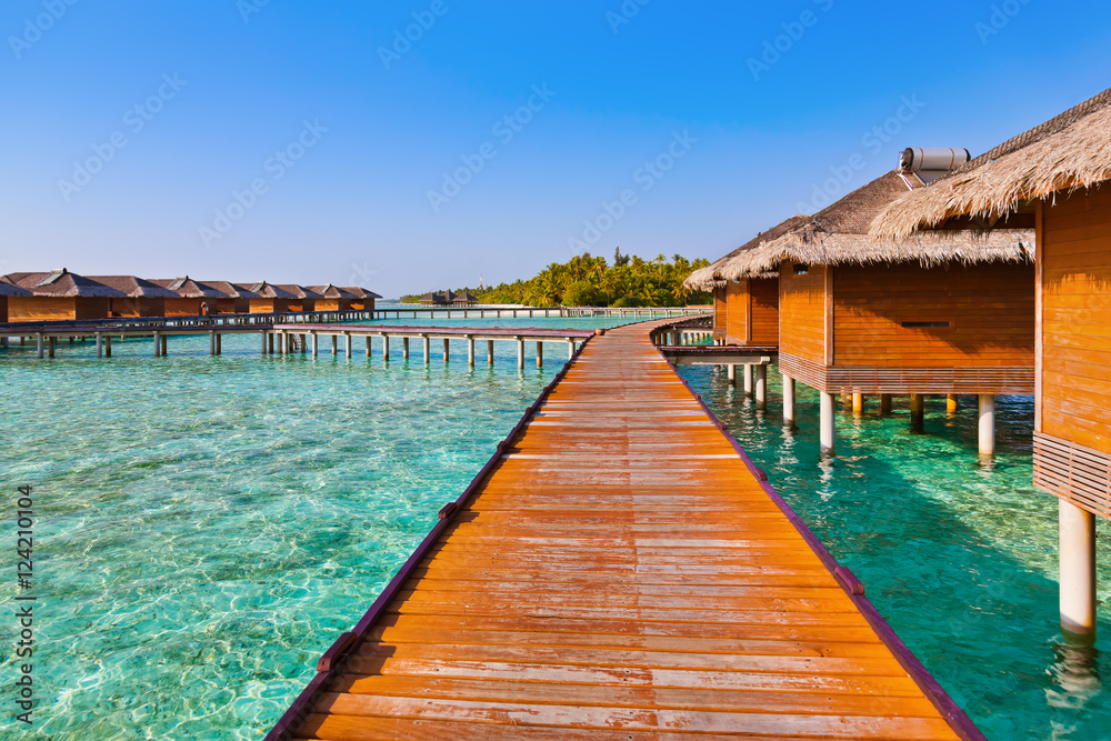 Bungalows on tropical Maldives island