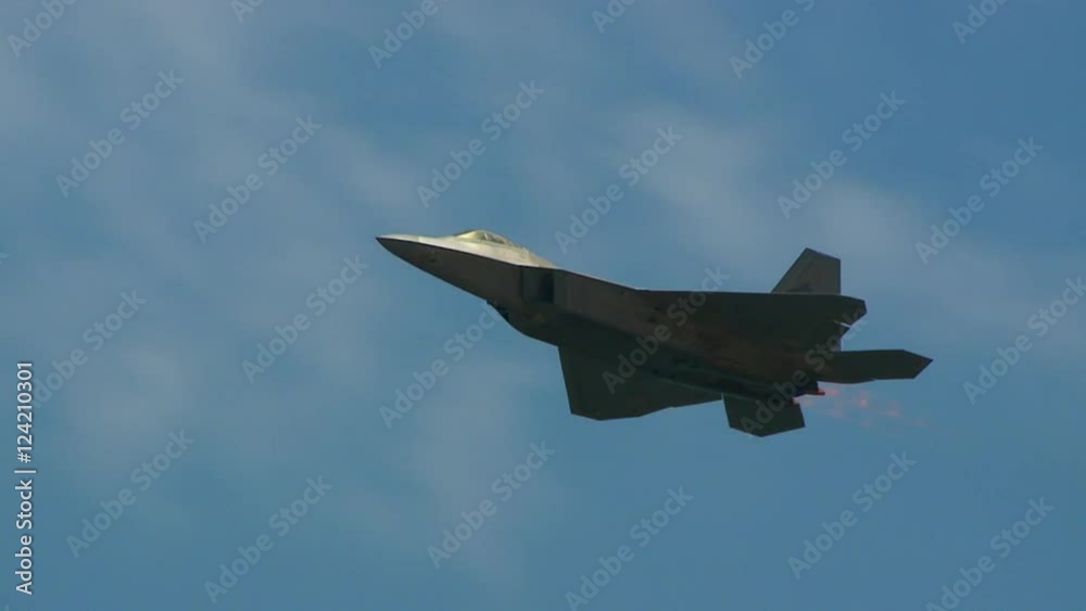 Tracking shot of F22 fighter jet flying in the sky Tracking shot of F22 fighter jet flying in the sky