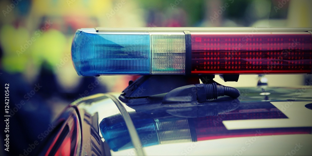 red and blue flashing lights of the police car at the checkpoint Stock