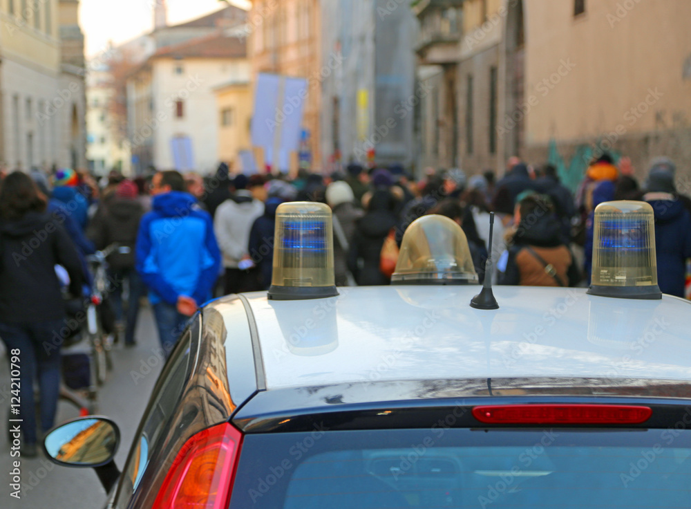 police car escorted the protesters during a street protest police car escorted the protesters during a street protest