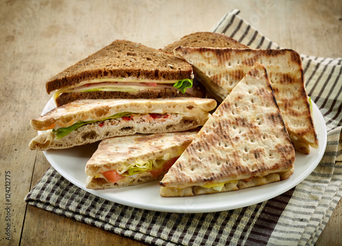 plate of various triangle sandwiches