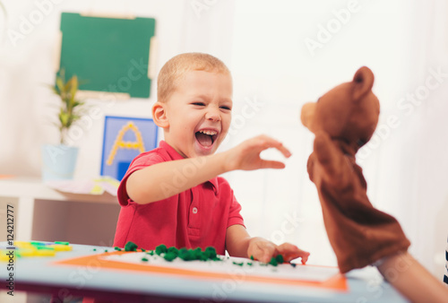 Εκτύπωση καμβά Little boy during lesson with his speech therapist. Learning thr