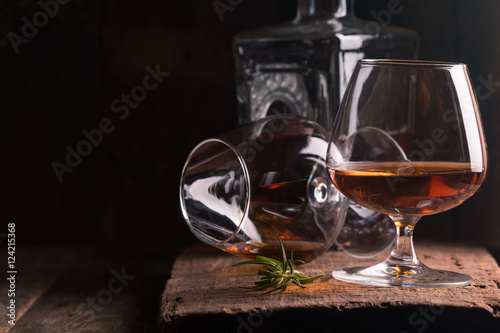 Glass of brandy or cognac and bottle
