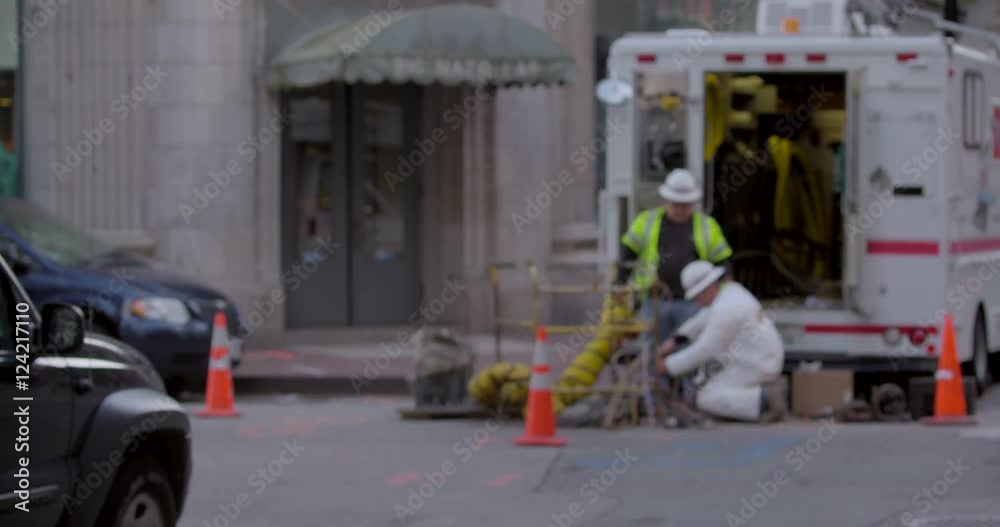 Soft focus of construction workers working on the road in city Soft focus of construction workers working on the road in city